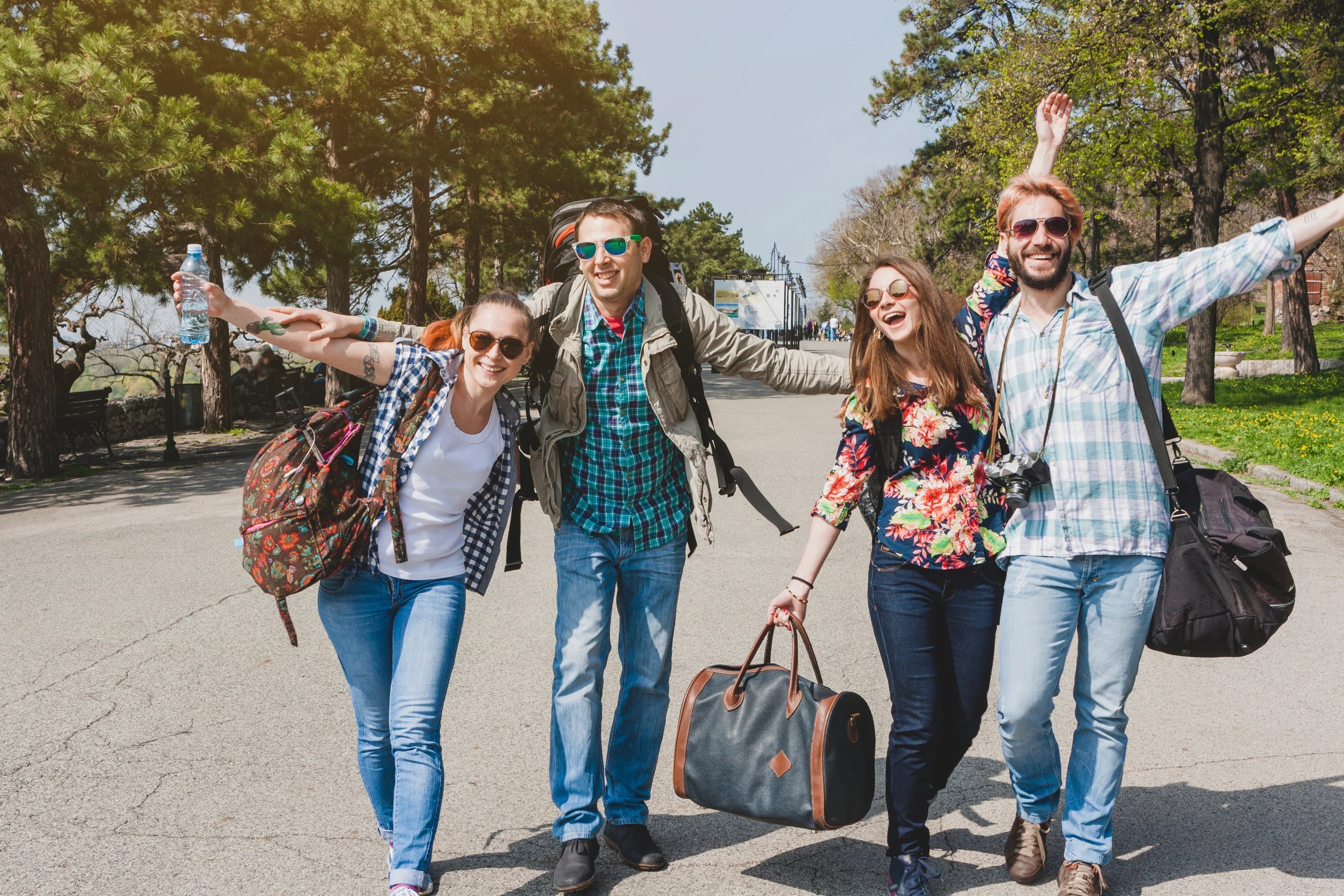 Group of friends outdoors in comfortable, allergy-free casual apparel, enjoying sunny day