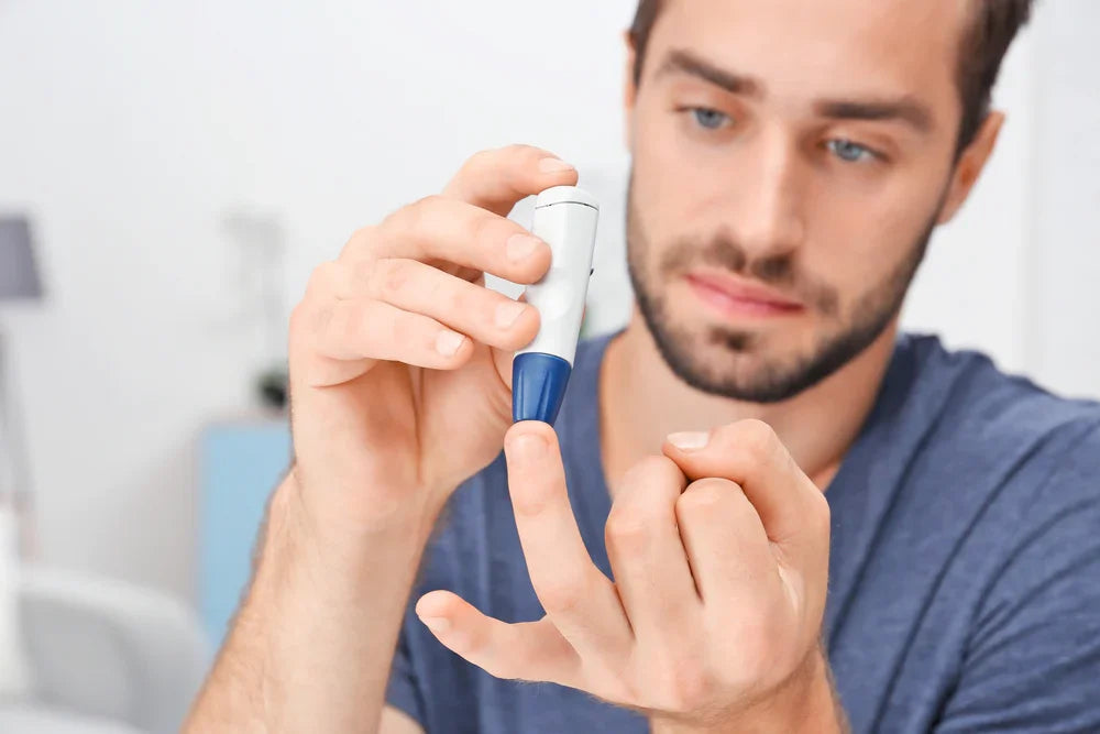 Man checking blood sugar with glucometer, diabetes test, eczema safe clothing context