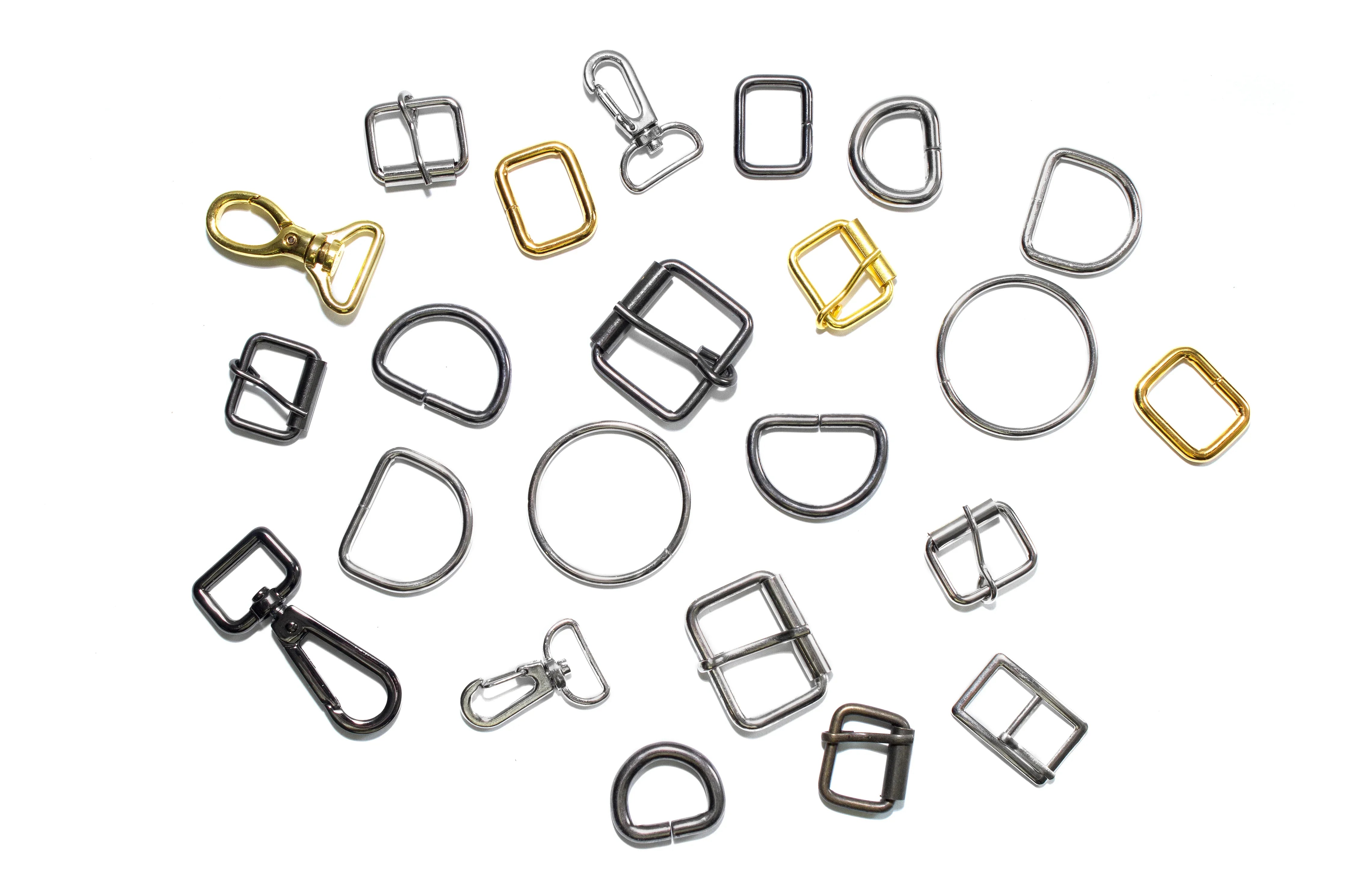 Assorted metal garment buckles and rings for allergy-free apparel on white background