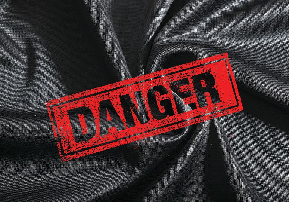 Black spandex fabric with a bold red "danger" warning sign overlayed, highlighting allergy risk.