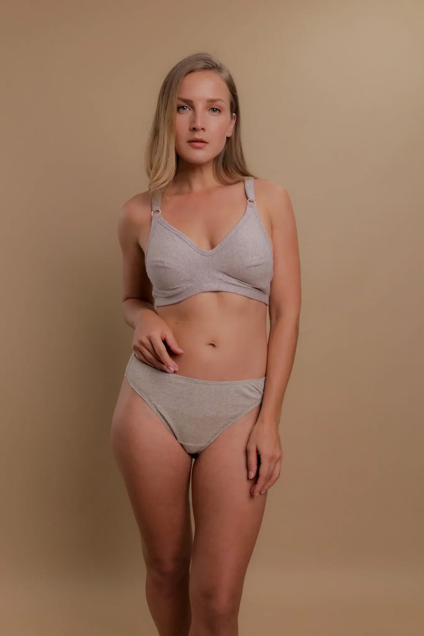 Woman wearing Cottonique hypoallergenic bra and briefs, allergy-free organic cotton apparel