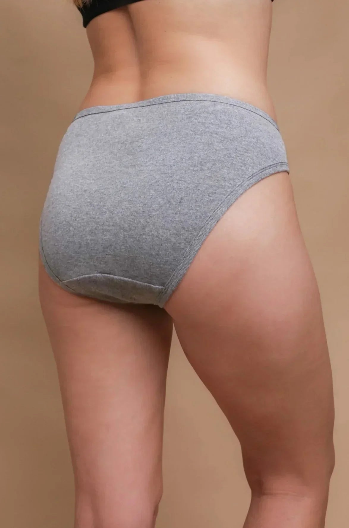 Back view of woman wearing grey hypoallergenic cotton underwear from Cottonique