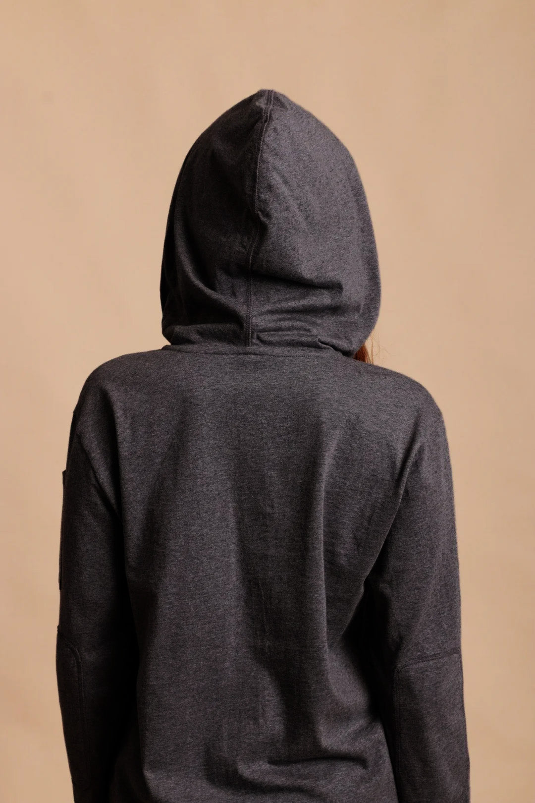 Back view of a dark gray hypoallergenic cotton hoodie from Cottonique