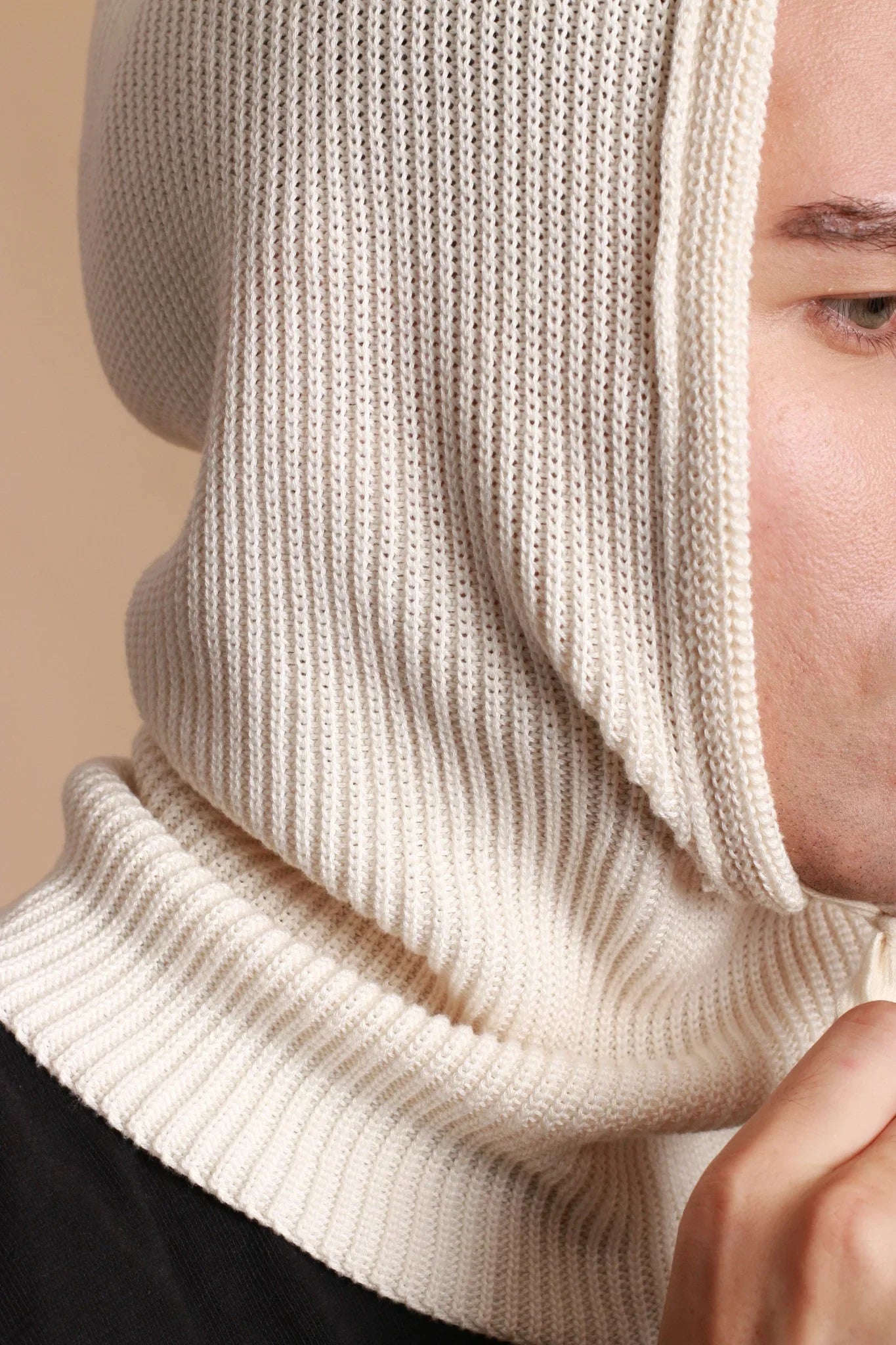 Man wearing hypoallergenic cream ribbed cotton hood from Cottonique