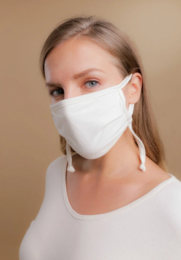 Woman wearing an organic cotton face mask for sensitive skin