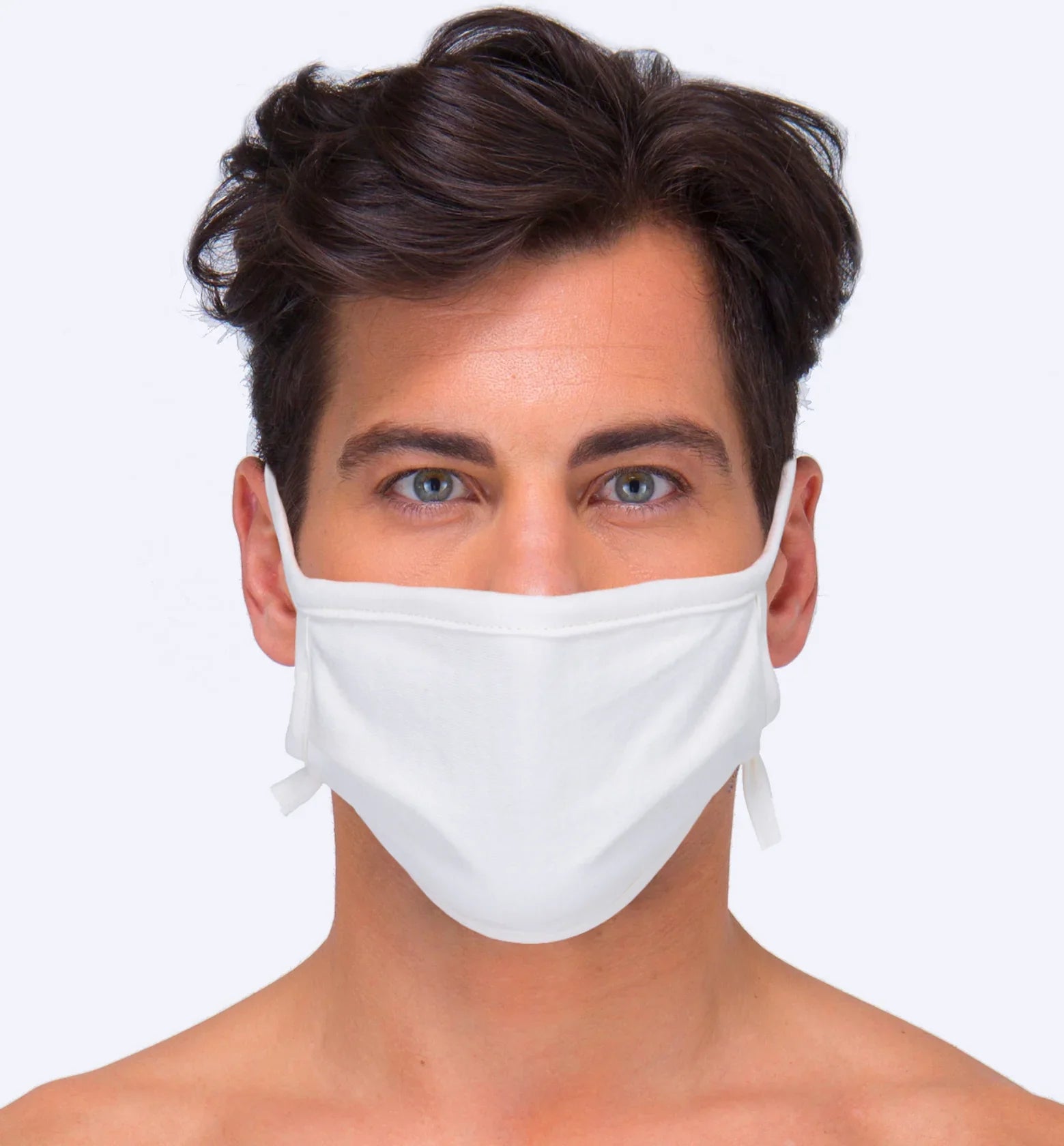 Man wearing white hypoallergenic cotton face mask, allergy-free apparel by Cottonique